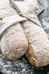 Fresh Italian bread on black background