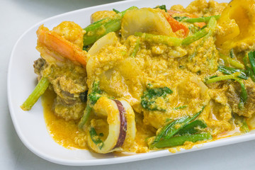 Fried seafood in yellow curry.