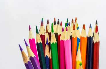 Many colored pencils isolate on white background
