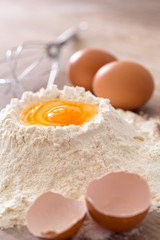 Mixing egg and flour .