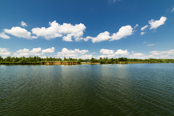 Clean lake and beautiful blue sky with clouds