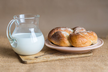 bun with butter and milk