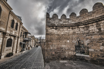 Fototapeta premium Empty street in old city of Baku, Azerbaijan. Old city Baku. İnner City buildings.