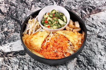 Pastry stuffed crispy egg crepe .