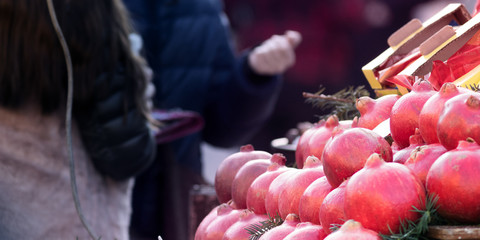 Red pomegranate displayed in a street market
