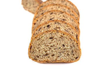 Dark rye bread with seeds on white background
