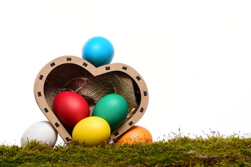 easter colorful eggs in wooden heart box isolated on white