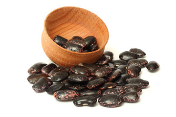 kidney beans on wood plate isolated on white background