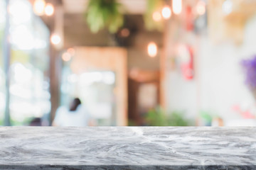 Stone table top and blurred restaurant interior background - can used for display or montage your products.