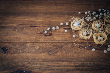 Easter decoration background. Quail eggs in nest with tag 