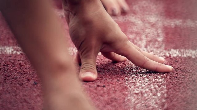 Athletics. Sprinter getting ready to start. 