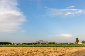 Landscape with view of sky and mountains in the background