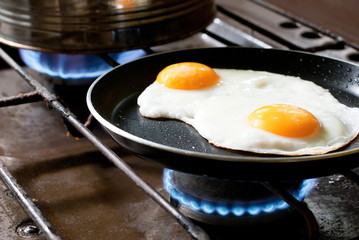 Fried eggs cooked on the stove