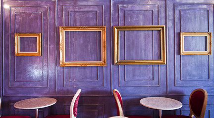 Cafe or Restaurant decorate with wooden wall and gold picture frame.