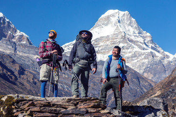 Multi national Team of Climbers staying on Rock