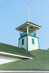 The ancient white observatory  and green roof tile with blue sky
