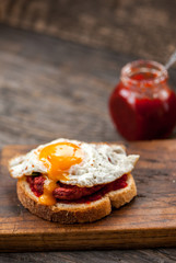 Vegetarian beetroot sandwich with egg, spinach and red chili jam