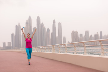 young woman celebrating a successful training run