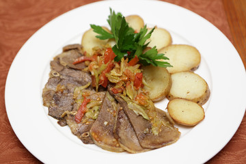 Baked tongue with potatoes