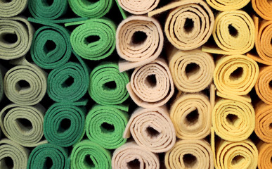 rolls of cloth and felt for sale in the shop for amateur tailors