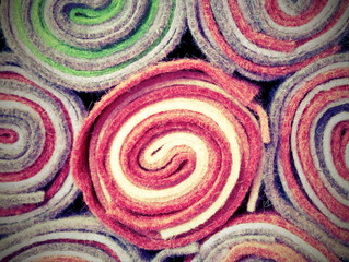 rolls of cloth and felt in the shop with vintage effect