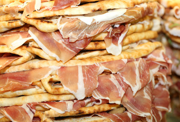 pile of stuffed tortillas with ham for sale in Italy
