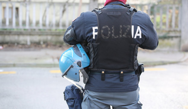 Italian police in riot gear with the words POLIZIA that means PO