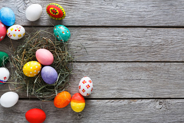 Colorful easter eggs on wood background