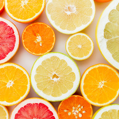 Obraz premium Citrus fruits on white background. Flat lay, top view.