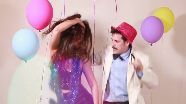 Beautiful girl and handsome guy fainting after dancing like crazy in photo booth, graded