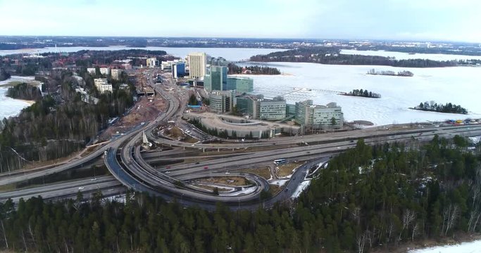 Route 51 Keilaniemi, Cinema 4k aerial pan view of route 51 the l&auml;nsi-v&auml;yl&auml; at keilaniemi business center, on a sunny winter day, in espoo, Finland