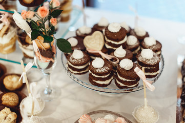 rows of italian mignon cakes on a glass stand