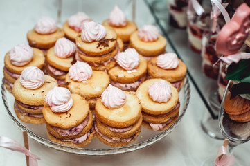 Sandwich cookies of yellow color. Lots of biscuits with custard. Pastry with vanilla filling.