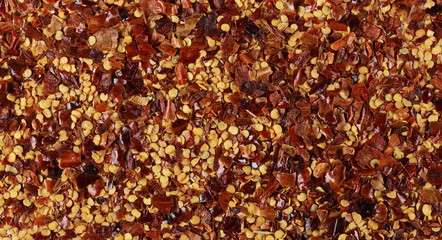 background crushed red pepper, dried chili flakes and seeds texture