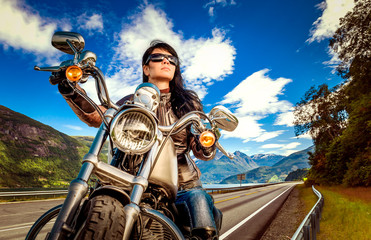 Naklejka premium Biker girl on a motorcycle