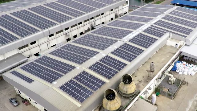 Aerial footage of solar panels on rooftop 