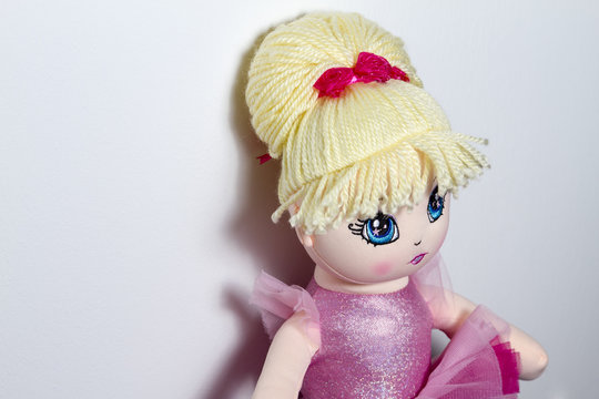 Close up of a ballerina doll on white background.