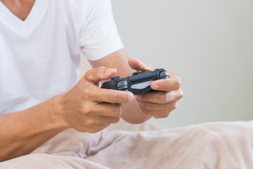 Hand young man presses a joystick game.