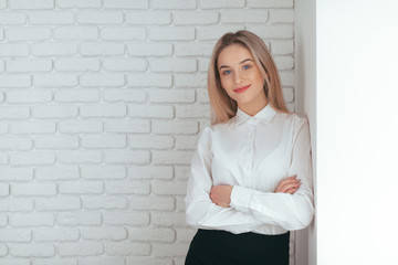 Portrait of beautiful young woman working in the office.