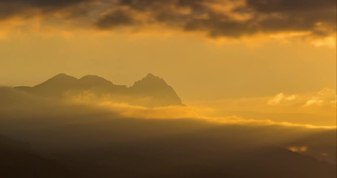 Sunrise time-lapse over the Chabrieres Needles mountain peaks in  Ecrins National Park. Aiguilles de Chabrieres, Hautes Alpes, Southern French Alps, France