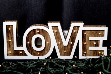 Love word letters in lights. Wooden letters with lights inside.