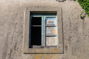 window in the wall of an abandoned house