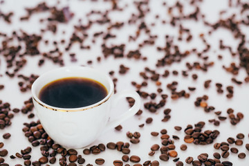 white coffee Cup and coffee beans on white background.