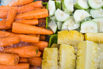 carrot, guava and pineapple on ice ready for fresh cool juice in summer