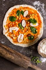 Raw Pizza Dough and Rolling Pin with Ingredients. Italian Pizza Making Concept.