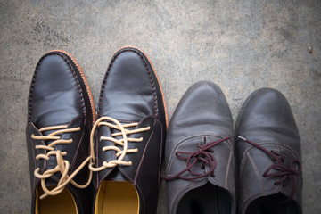 Two different Pairs of brown classic modern shoes
