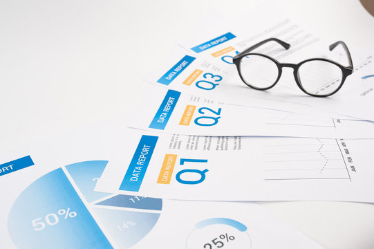 Documents with chart and graph as a background. Business concept.