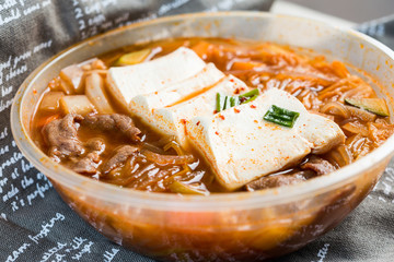 Bowls of Asian soup noodles and vegetables