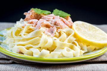 tasty pasta with salmon on a the table