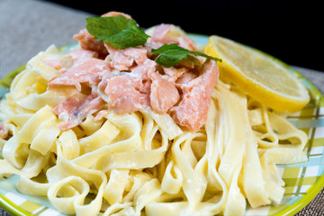 tasty pasta with salmon on a the table